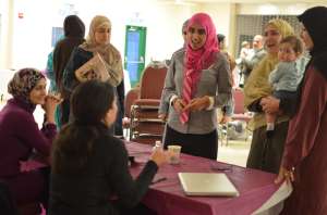Maggie and Laila sign books and engage with attendees after their presentation at Dar Al Taqwa
